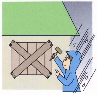 大雨の中、男性が窓に板を打ち付けているイラスト